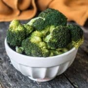 cooked broccoli in a white bowl