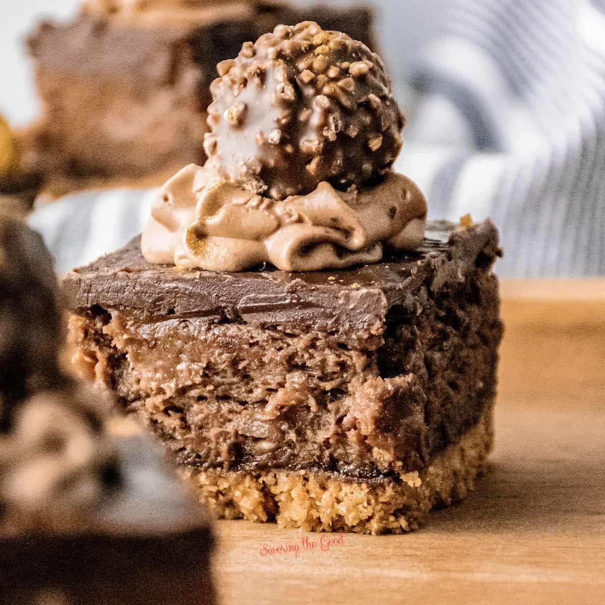 Nutella Cheesecake Bar on a wooden board, hero image.