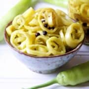 Pickled Banana Peppers in an earthenware bowl.