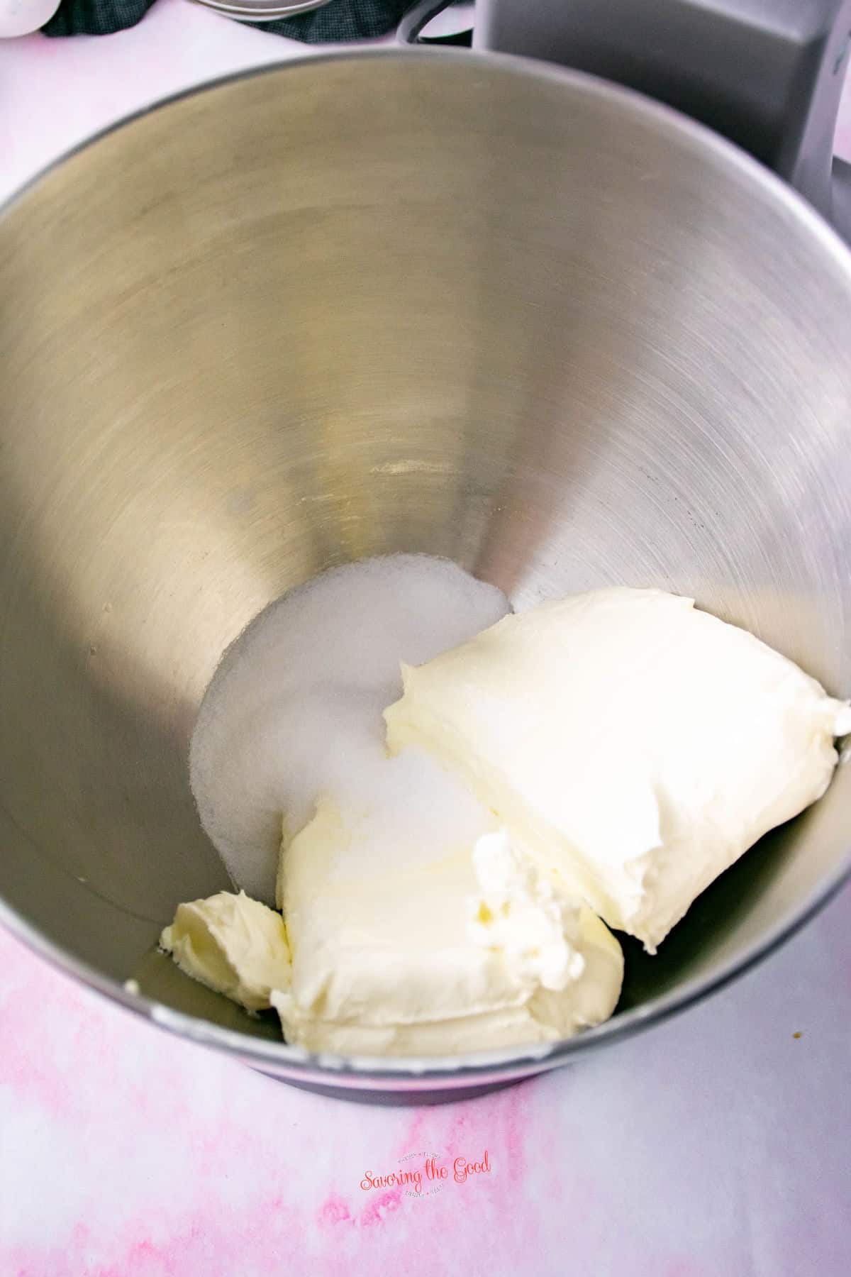 cream cheese and sugar in a mixing bowl.