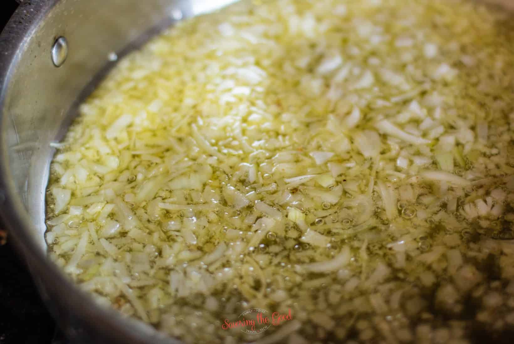diced onions in olive oil cooking.