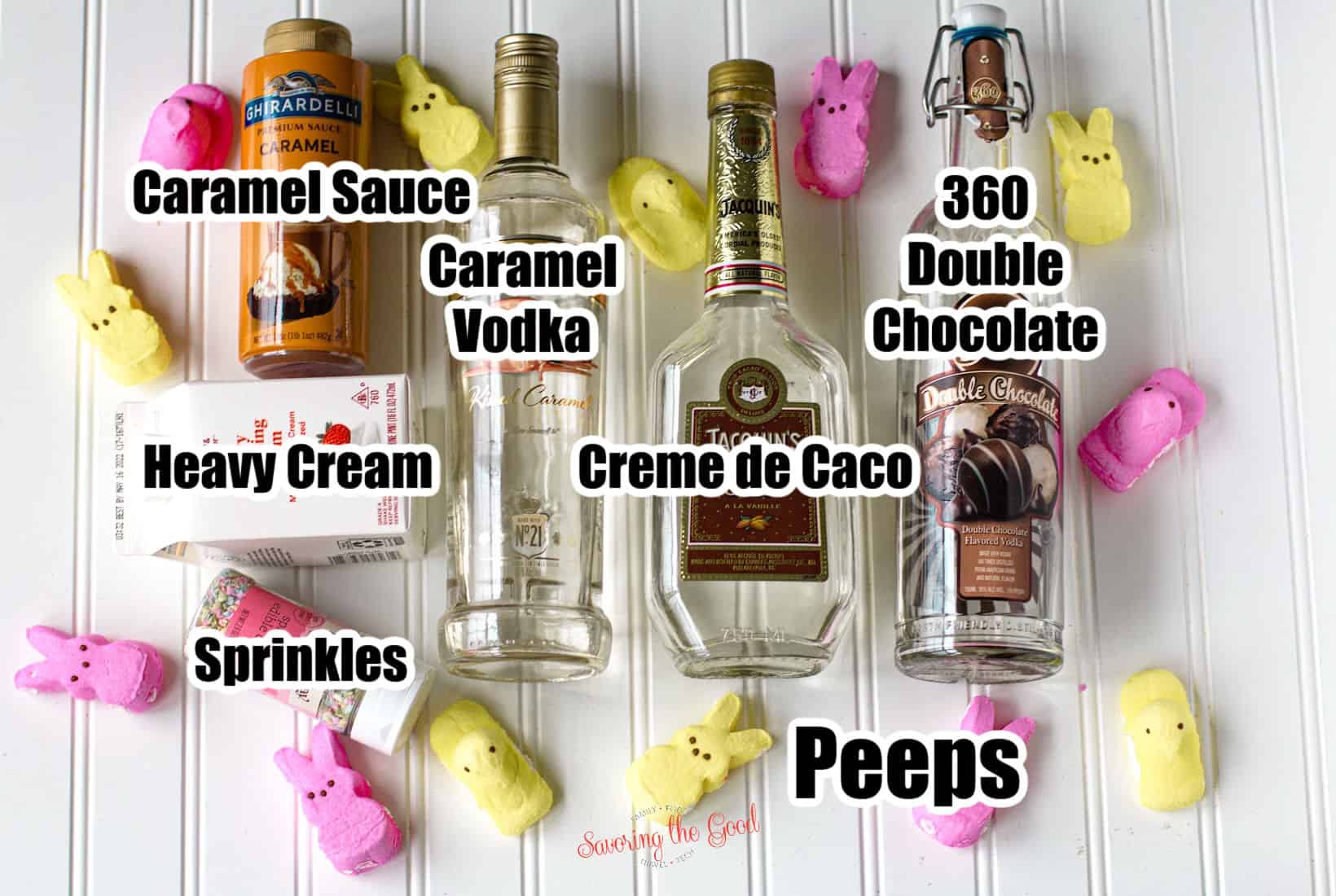 ingredients to make an easter cocktail, caramel vodka, creme de caso, 360 double chocolate, heavy cream, sprinkles, text over them labeling.