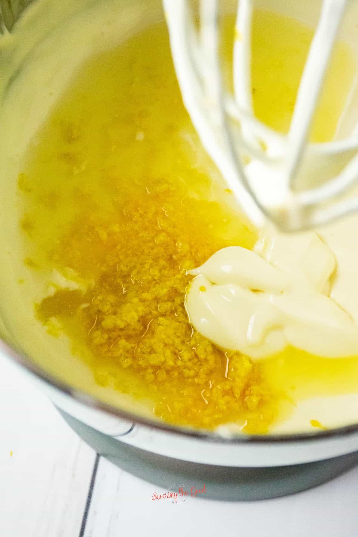 lemon zest, lemon juice, eggs cream cheese and sour cream in a mixing bowl with whip atachment.