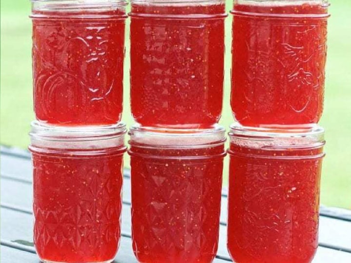 strawberry jam jars stacked.
