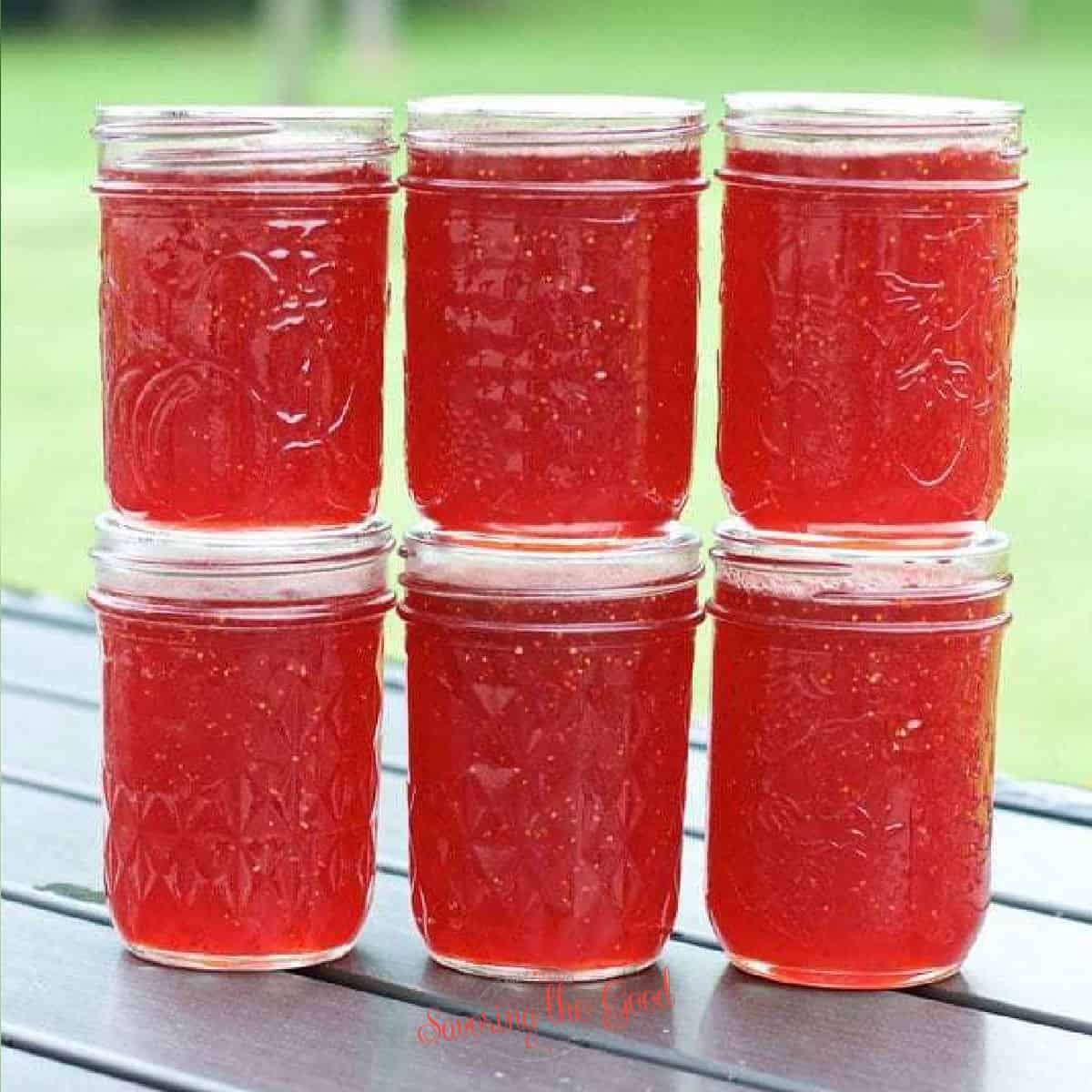 strawberry jam jars stacked.