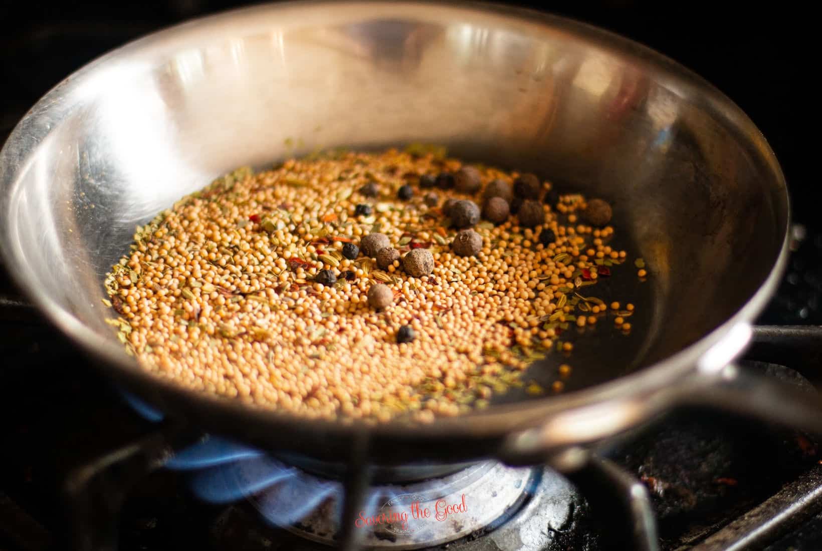 corned beef seasoning in a pan, toasting.