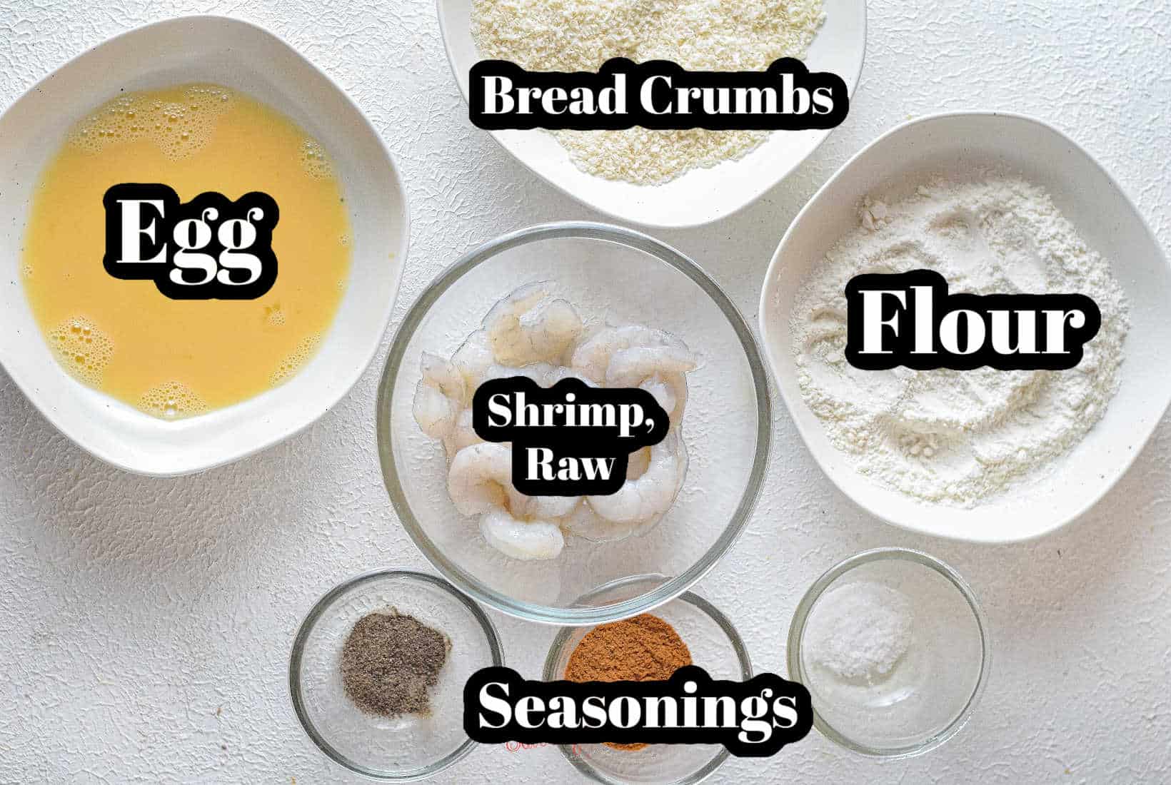 ingredients for popcorn shrimp with text overlay, rawy shrimp, egg, bread crumbs, flour, seasoning.