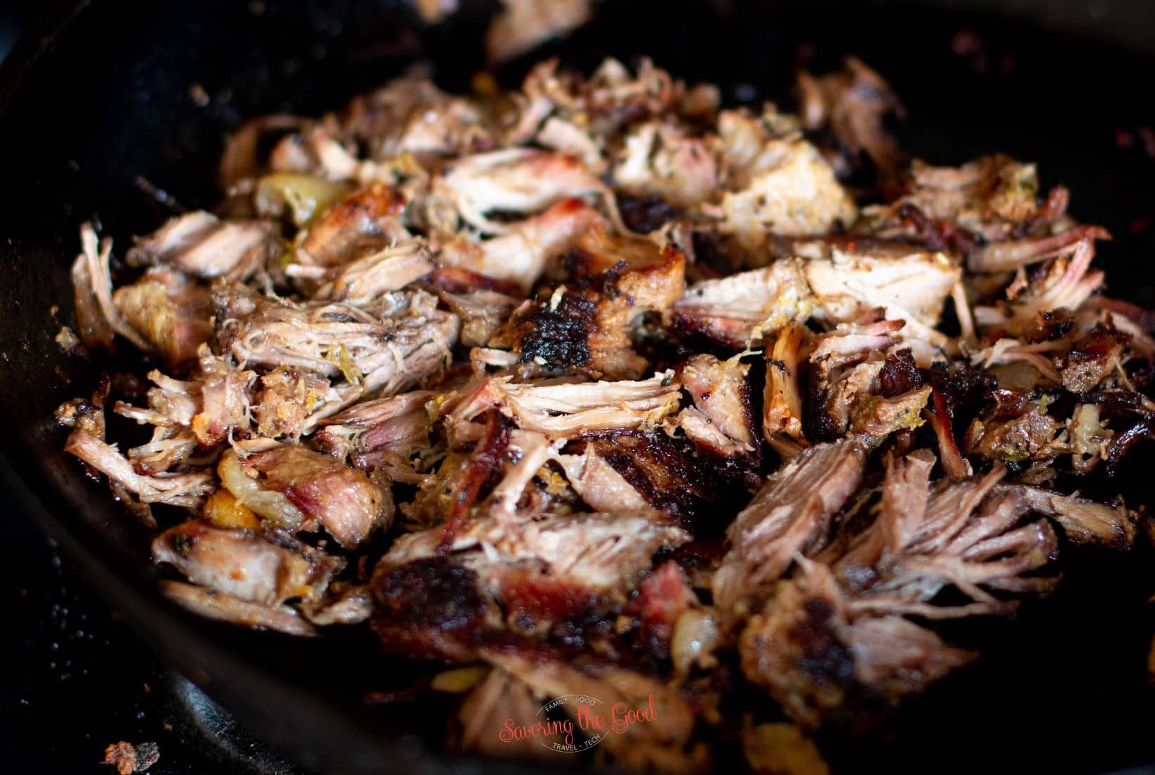 beautiful mojo pork seared in the cast iron pan.