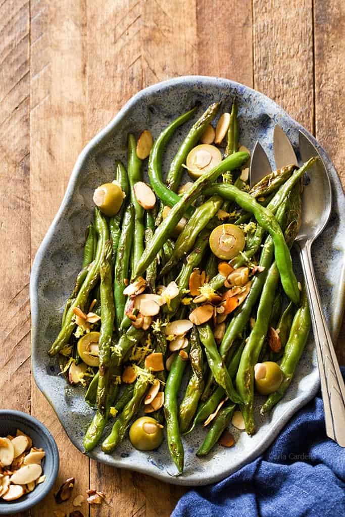 green beans are snappy and bright with almonds and garlic stuffed olives.