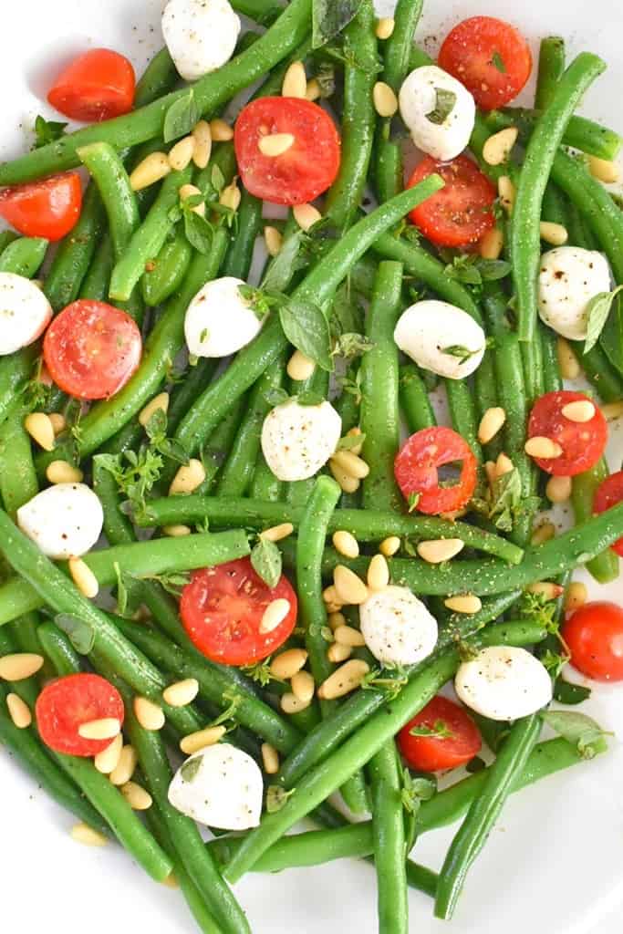 green bean salad with mini bocconcini cheese, cherry tomatoes and lemon herb vinaigrette
