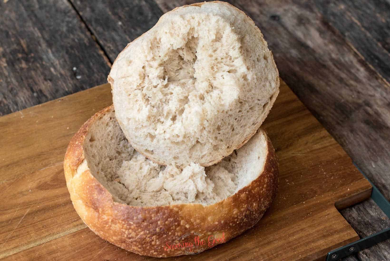 round bread bowl with the cop cut out showing how to cut on an angle.