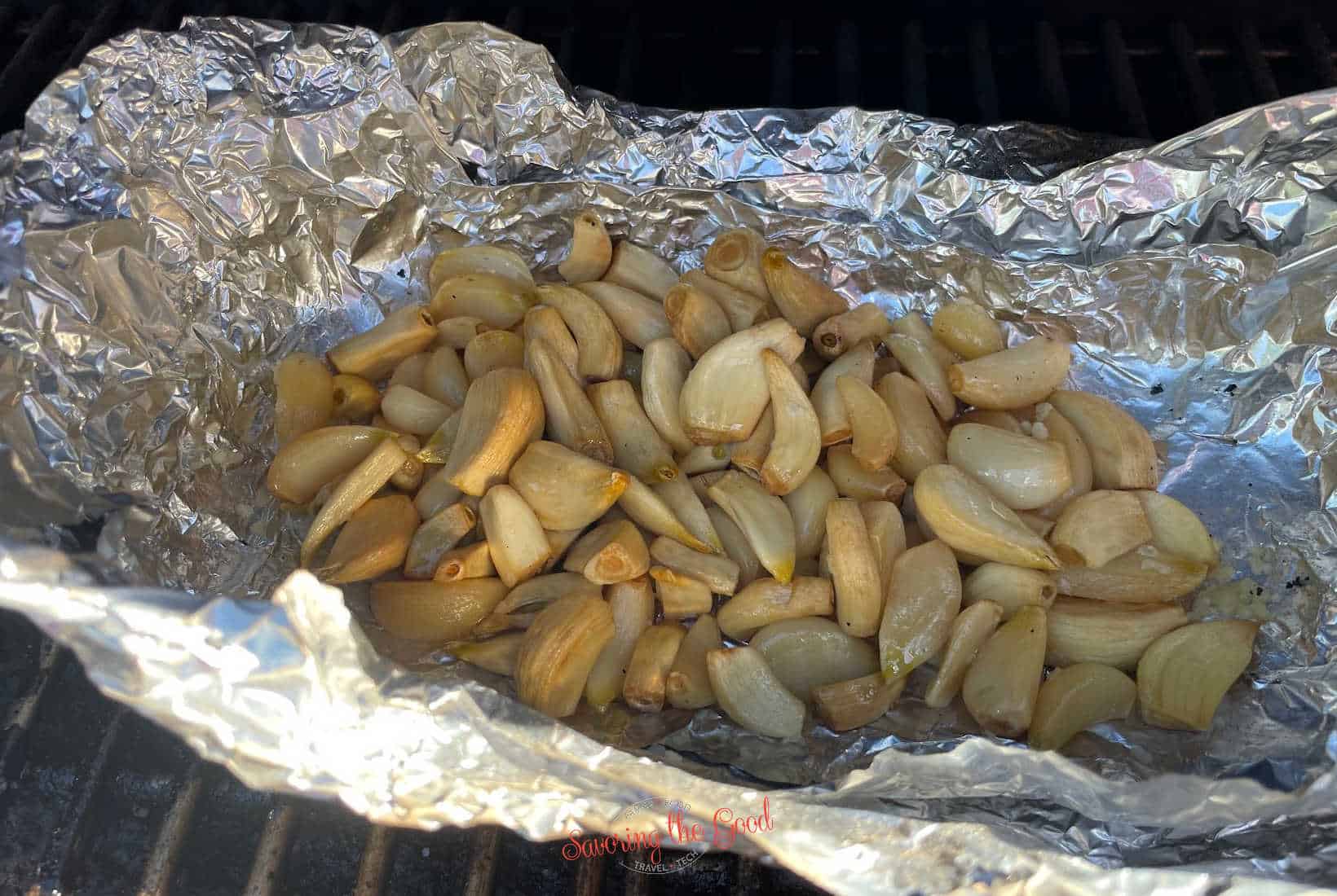 smoked garlic cloves in a foil pouch on the grill.