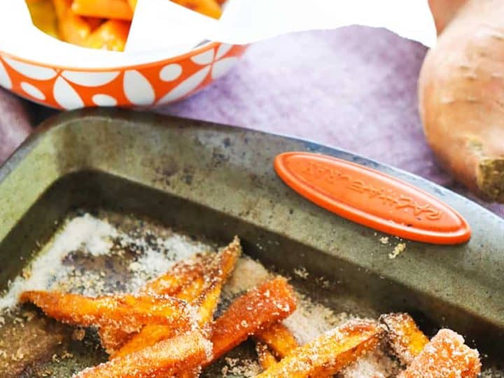 Sweet potato fries on a baking sheet.