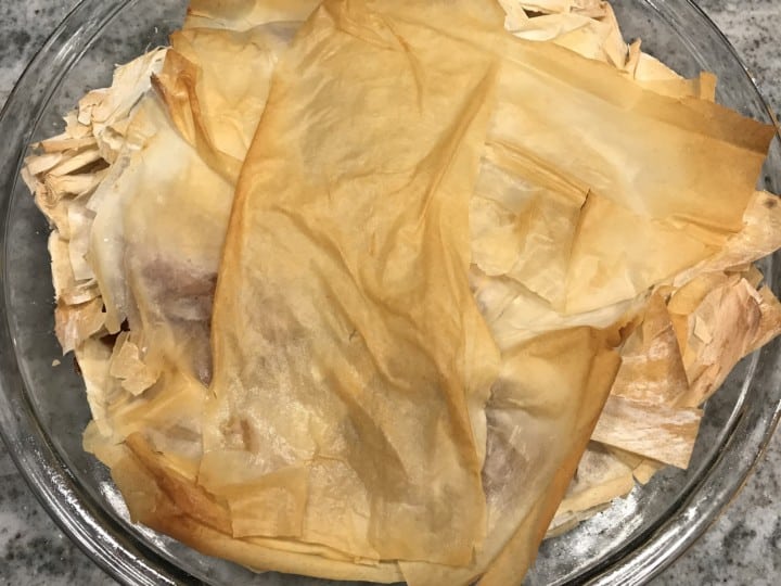 A plate with what looks like pieces of paper on it