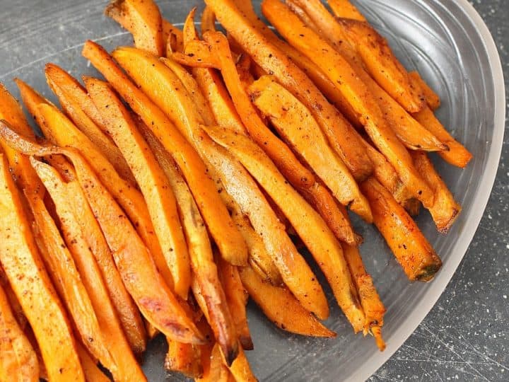 Baked sweet potato fries on a plate.