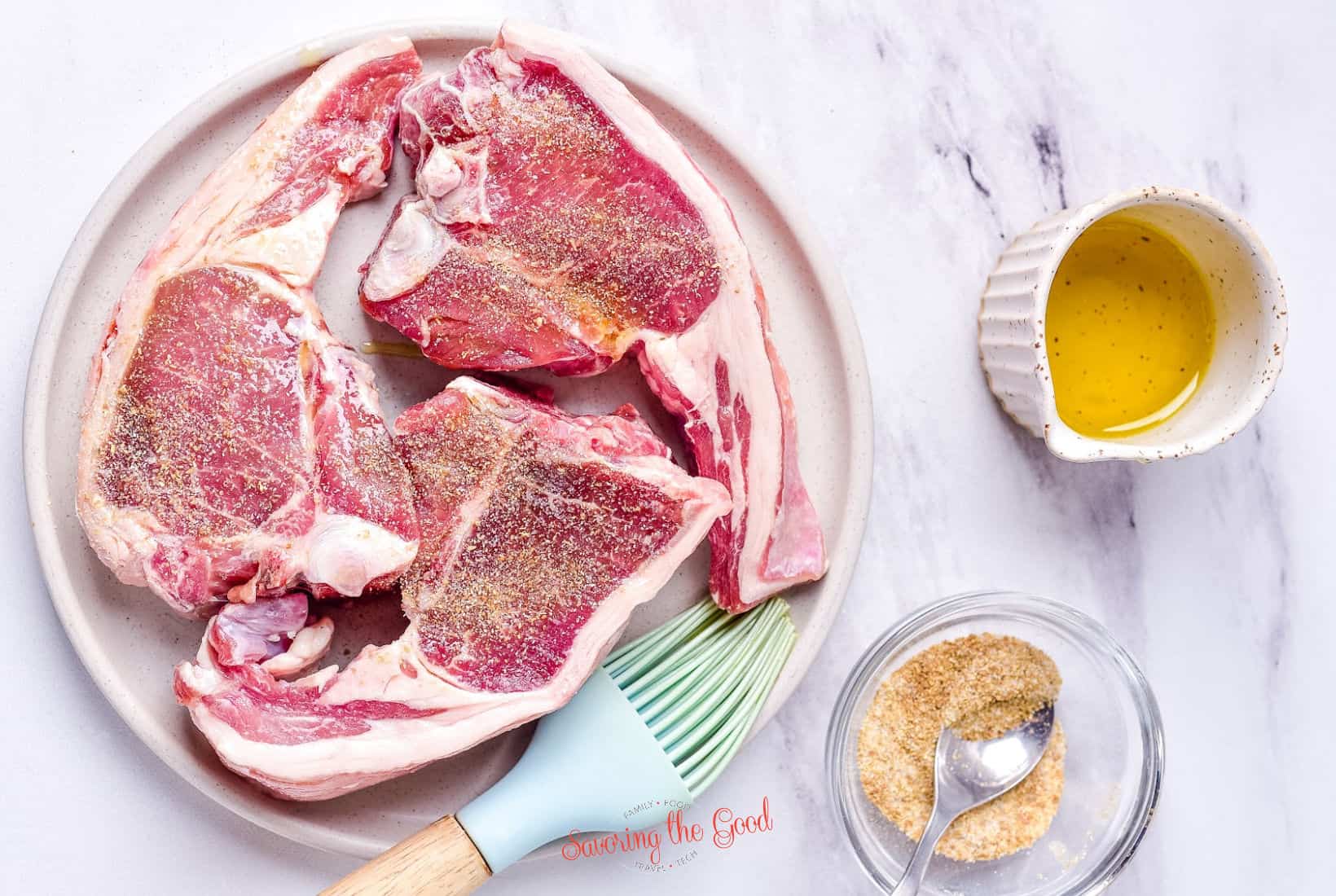 lamb chops seasoned with garlic powder, coriander , olive oil and salt.