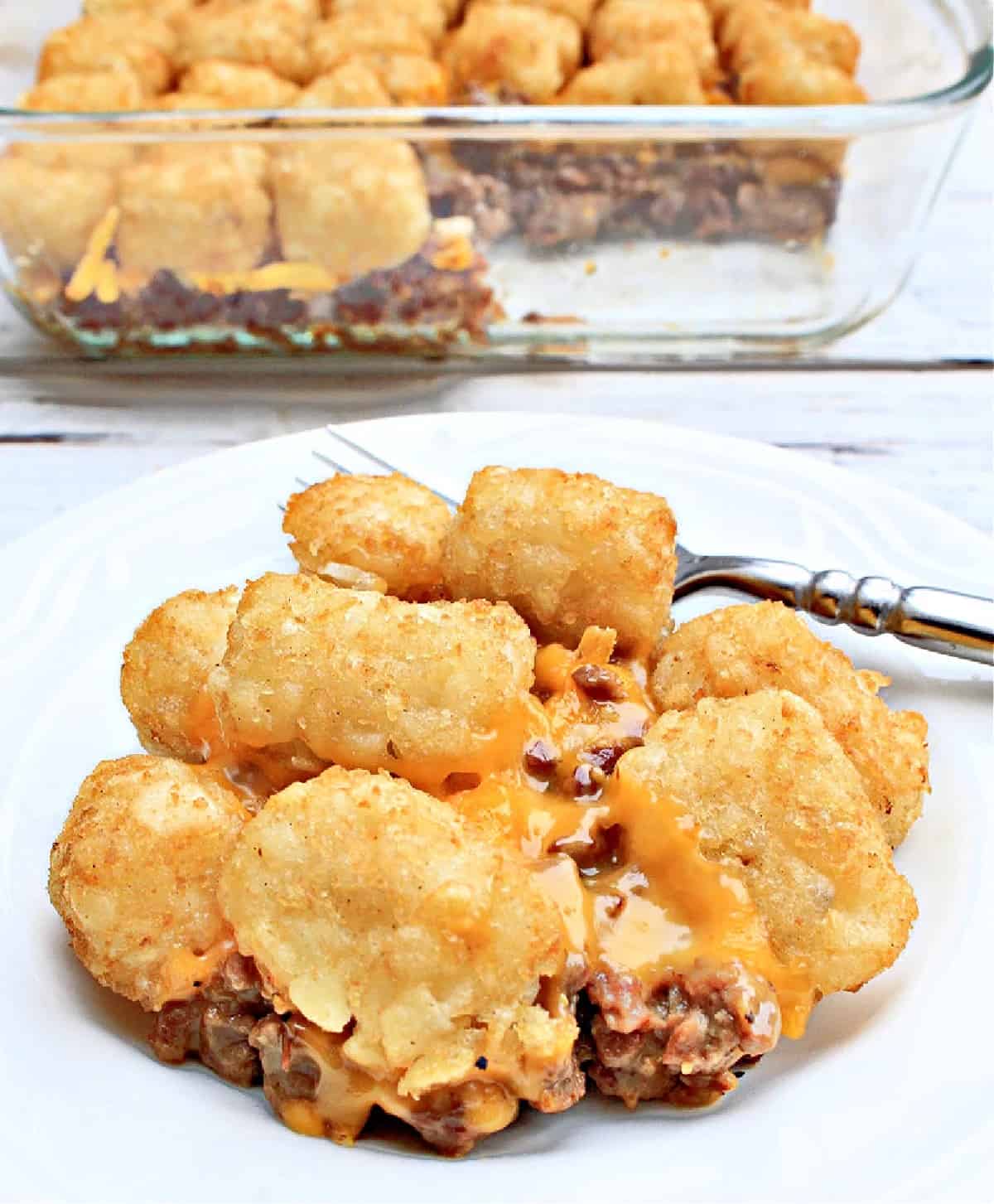 Beyond sausage tater tot casserole on a plate with a fork.