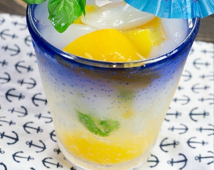 A moonshine recipe with a blue umbrella on a napkin.