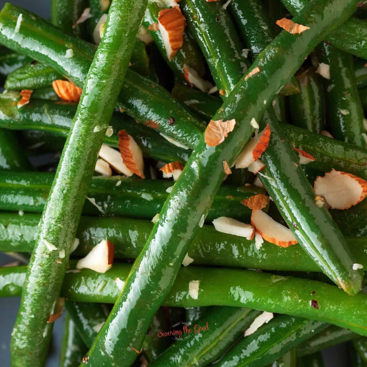 canned green beans with crumbled almonds, square image.