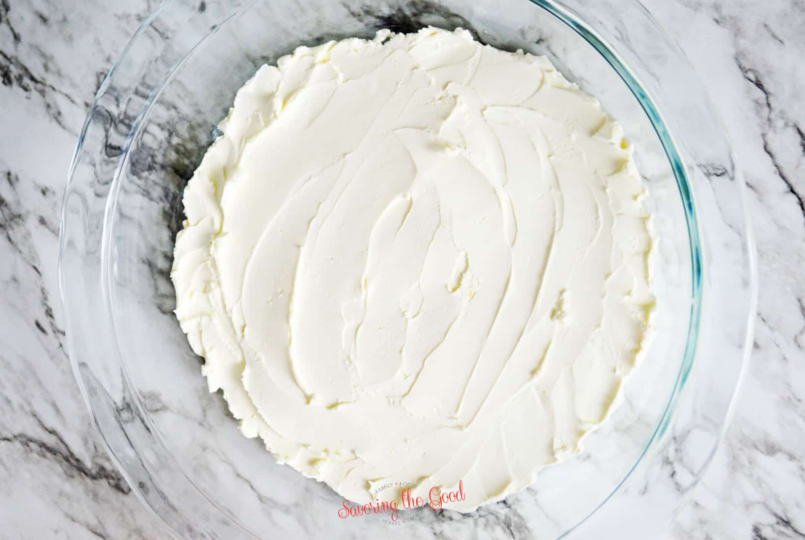 cream cheese in a glass pie plate.