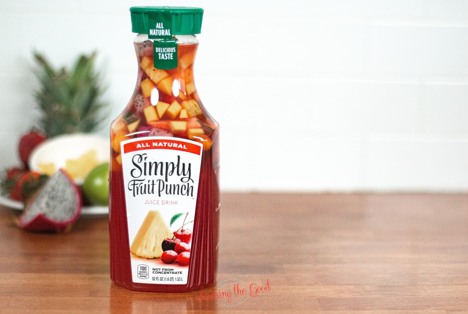 jungle juice in simply fruit punch with chopped fruit in the container.