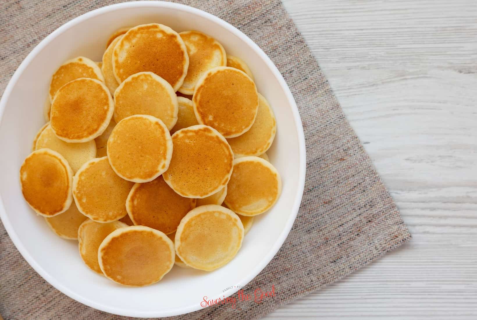 mini pancakes on a white plate.