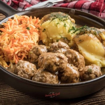 Swedish meatballs in gravy with potatoes and carrots.
