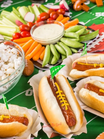 Hot dogs and vegetables on a football field.for fame day food ideas.
