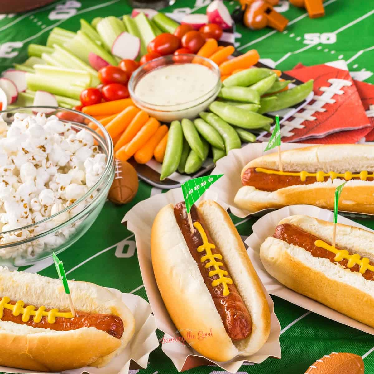 Hot dogs and vegetables on a football field.for fame day food ideas.