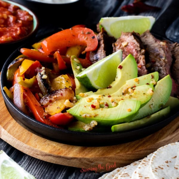 Mexican steak fajitas in a skillet for featured image of sides for fajitas.