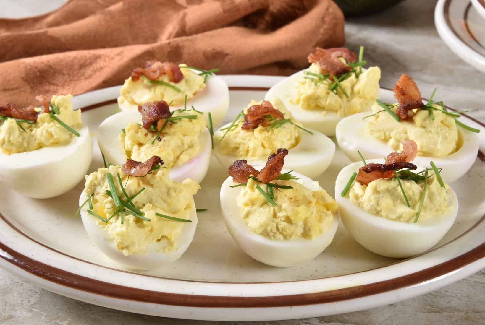 Deviled eggs with bacon and chives.