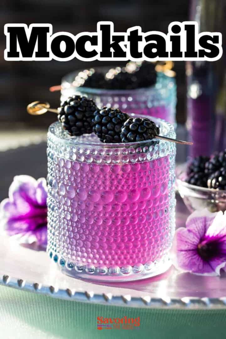Blackberry mocktails with blackberries and flowers.