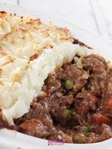 A casserole dish with meat and mashed potatoes.