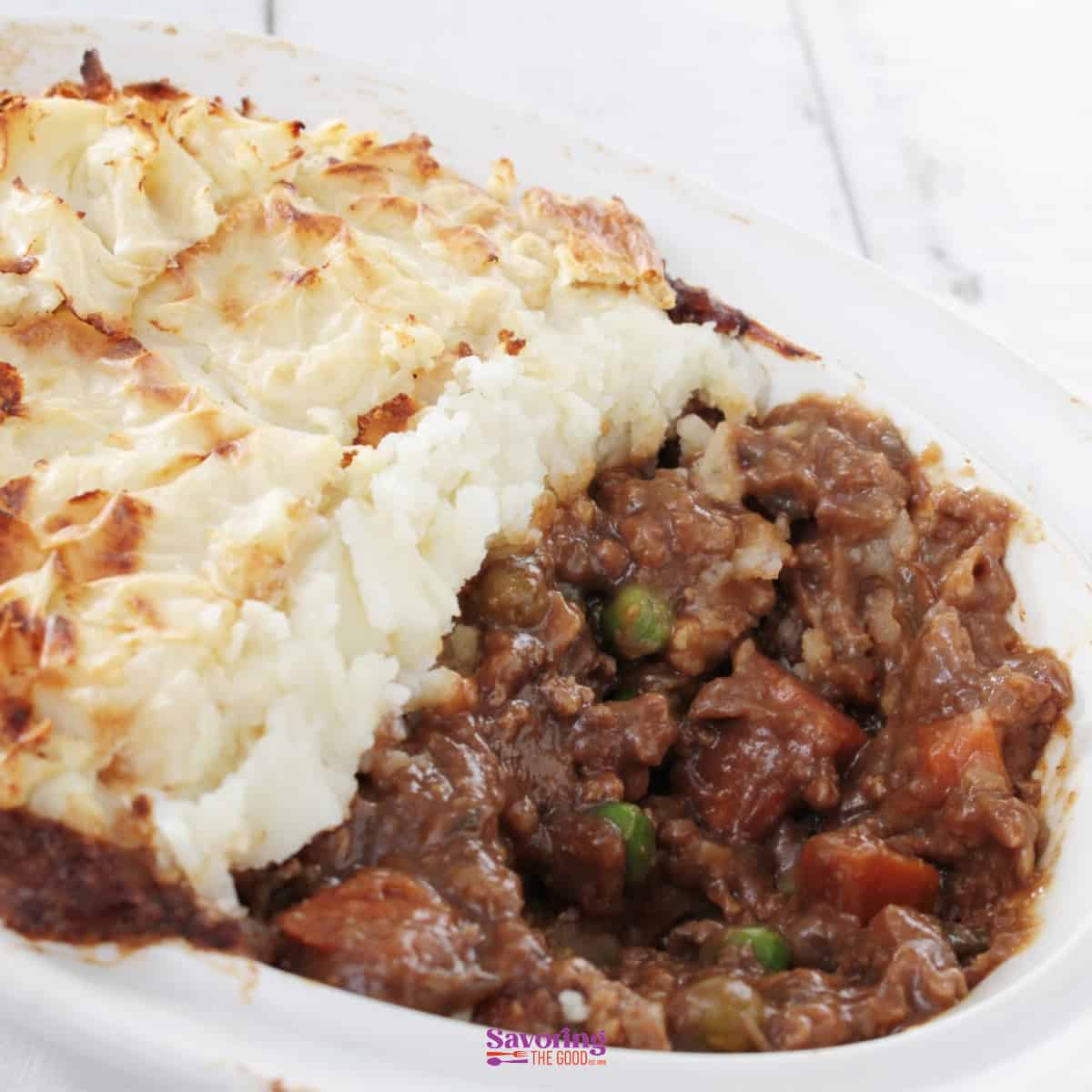 A casserole dish with meat and mashed potatoes.