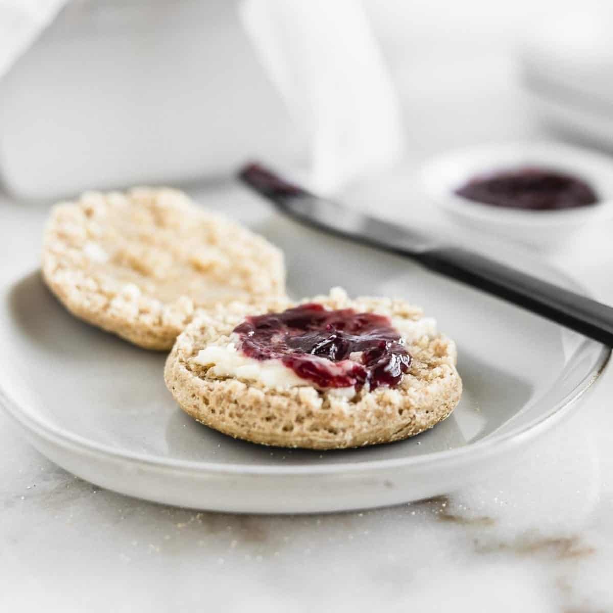 Scones with jam on a plate.