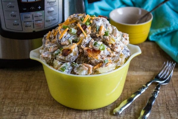 Instant pot potato salad in a yellow bowl.
