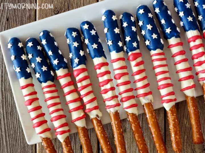 Patriotic pretzel sticks on a white plate.