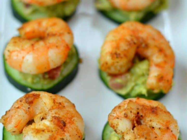 Shrimp appetizers with guacamole and cucumbers.