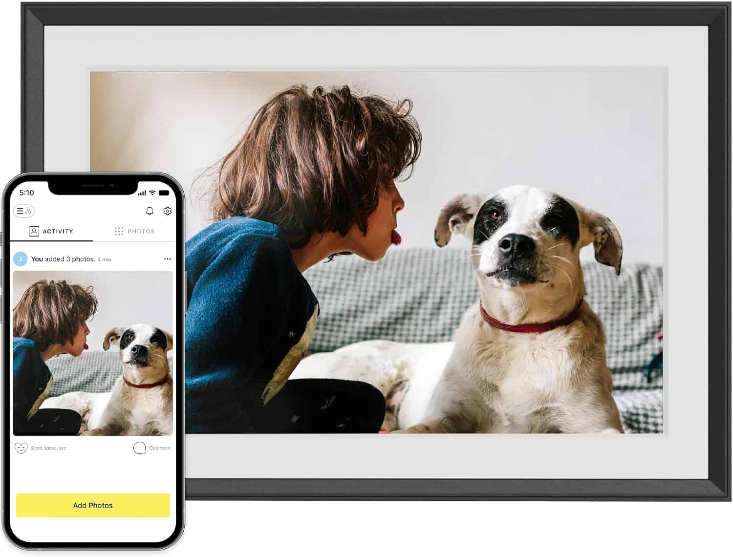 A digital photo frame, perfect for Fatherโs Day gifts, displays an image of a person leaning toward a white and black dog; a smartphone shows the same photo on its screen.