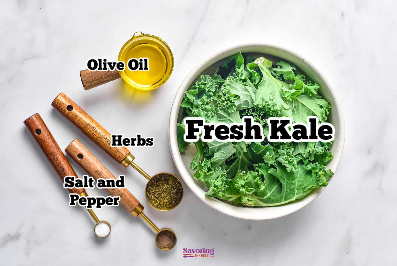 Image showing a bowl labeled "Fresh Kale" alongside small containers labeled "Olive Oil," "Herbs," and "Salt and Pepper" on a marble surface, perfect for making air fried kale chips.