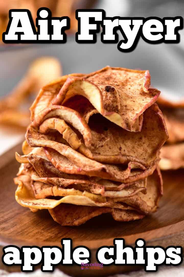 Close-up of a stack of apple chips on a wooden surface with the text "Air Fryer apple chips" displayed in bold letters above and below the stack.