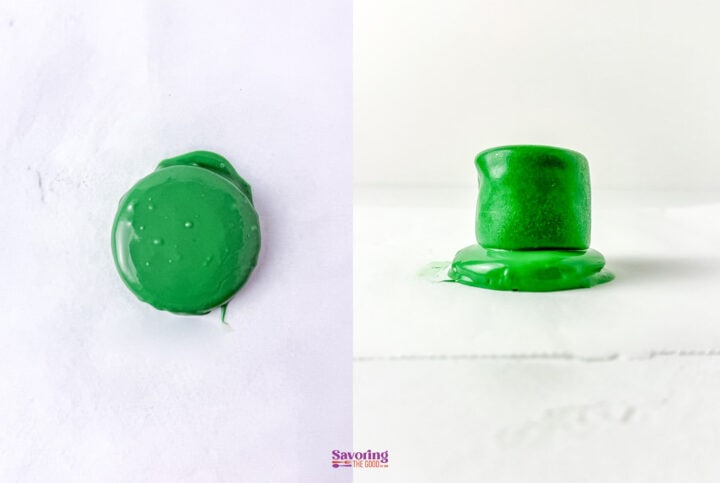Green chocolate-covered marshmallow on white surface, shown from top and side view.