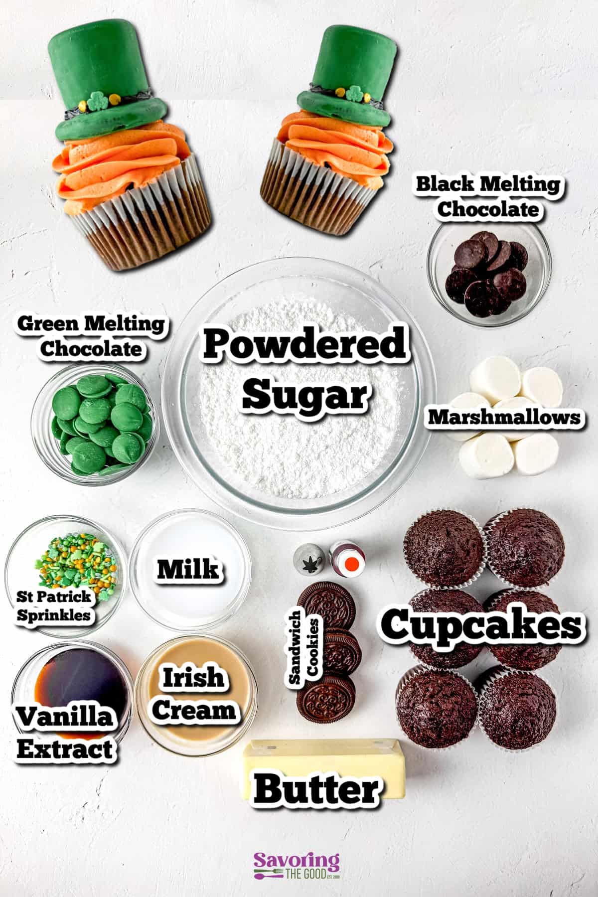 Assorted baking ingredients including cupcake with green fondant, powdered sugar, melting chocolates, marshmallows, milk, butter, sandwich cookies, Irish cream, and vanilla extract.
