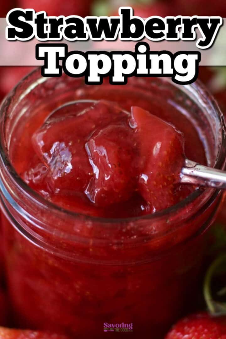 Jar of strawberry topping with a spoon, showcasing a glossy and chunky texture.