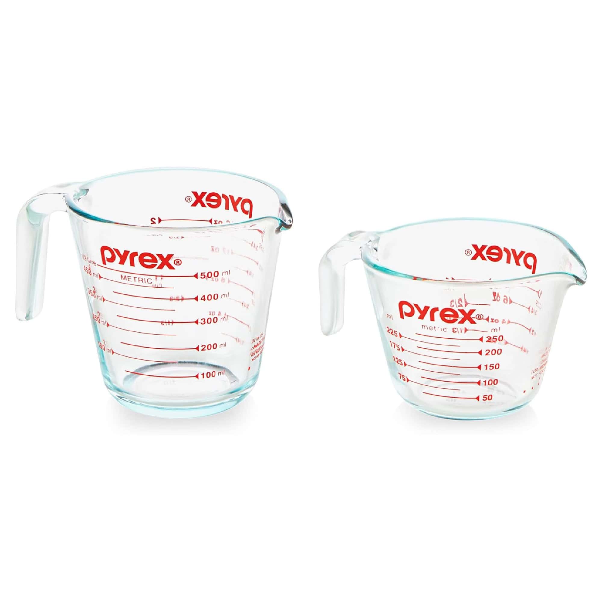 Two clear glass Pyrex measuring cups, one larger with a 1-liter capacity and one smaller with a 500-milliliter capacity, both featuring red measurement markings.