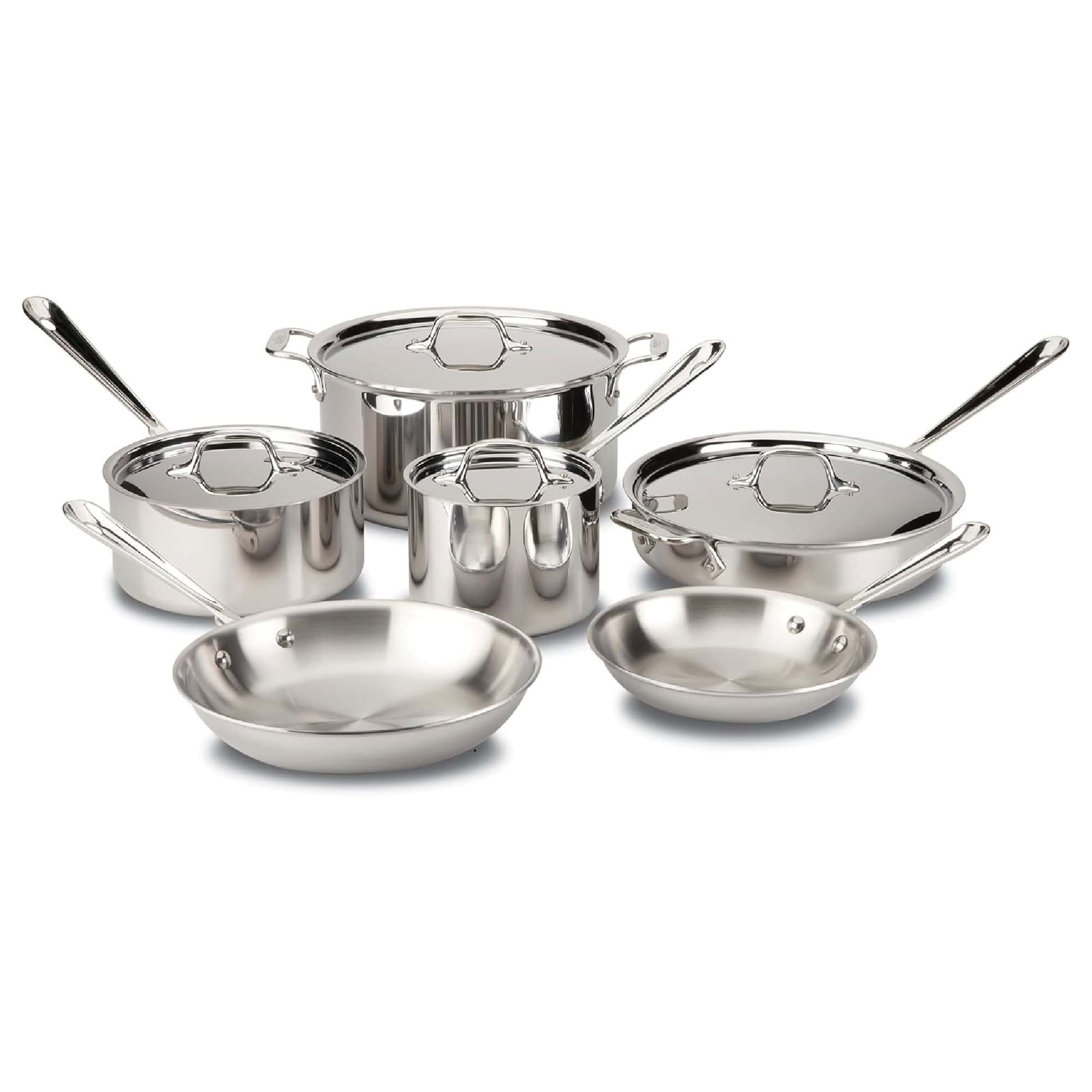 Set of stainless steel cookware including pots, pans, and lids arranged on a white background.