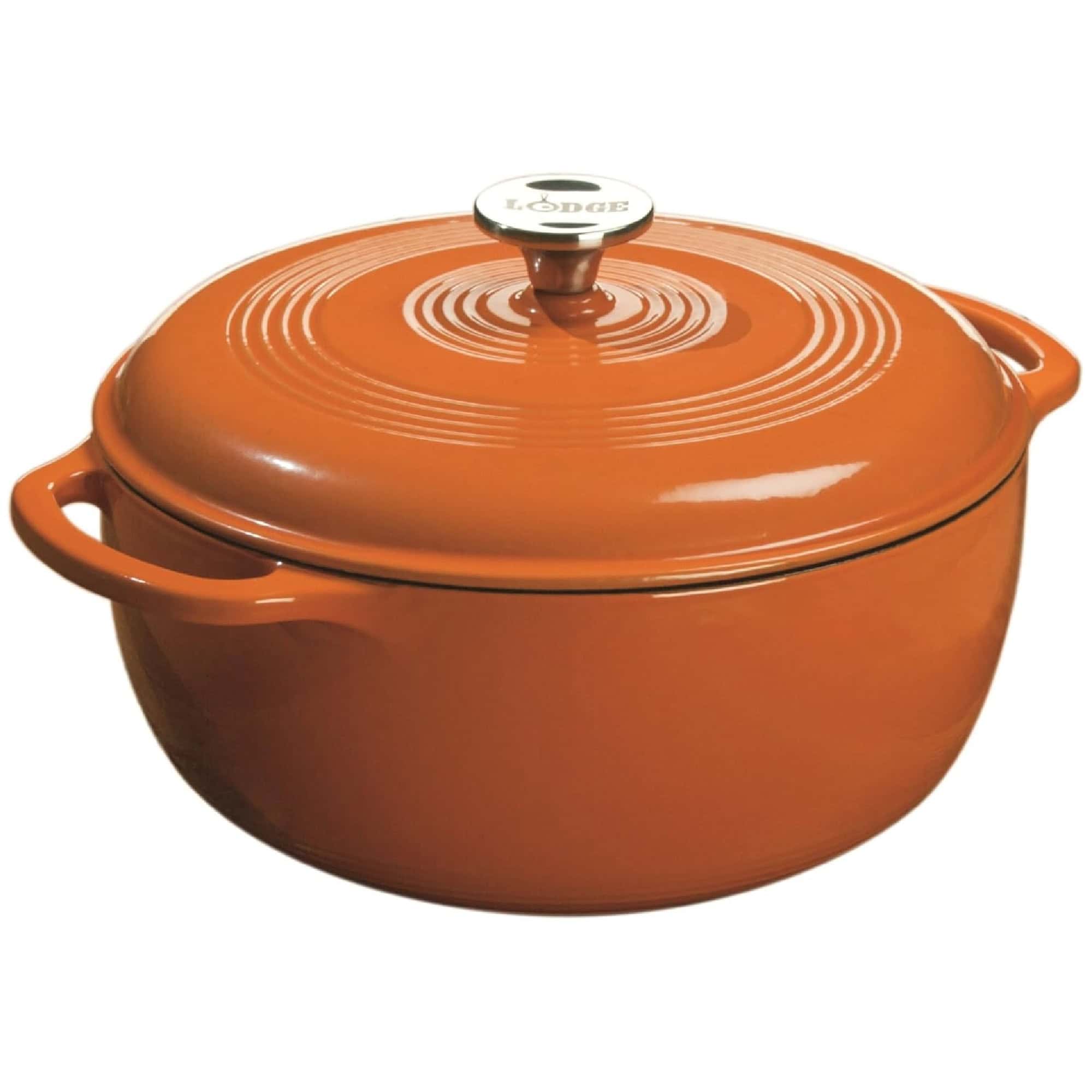 Orange cast iron Dutch oven with a lid and rounded handles.