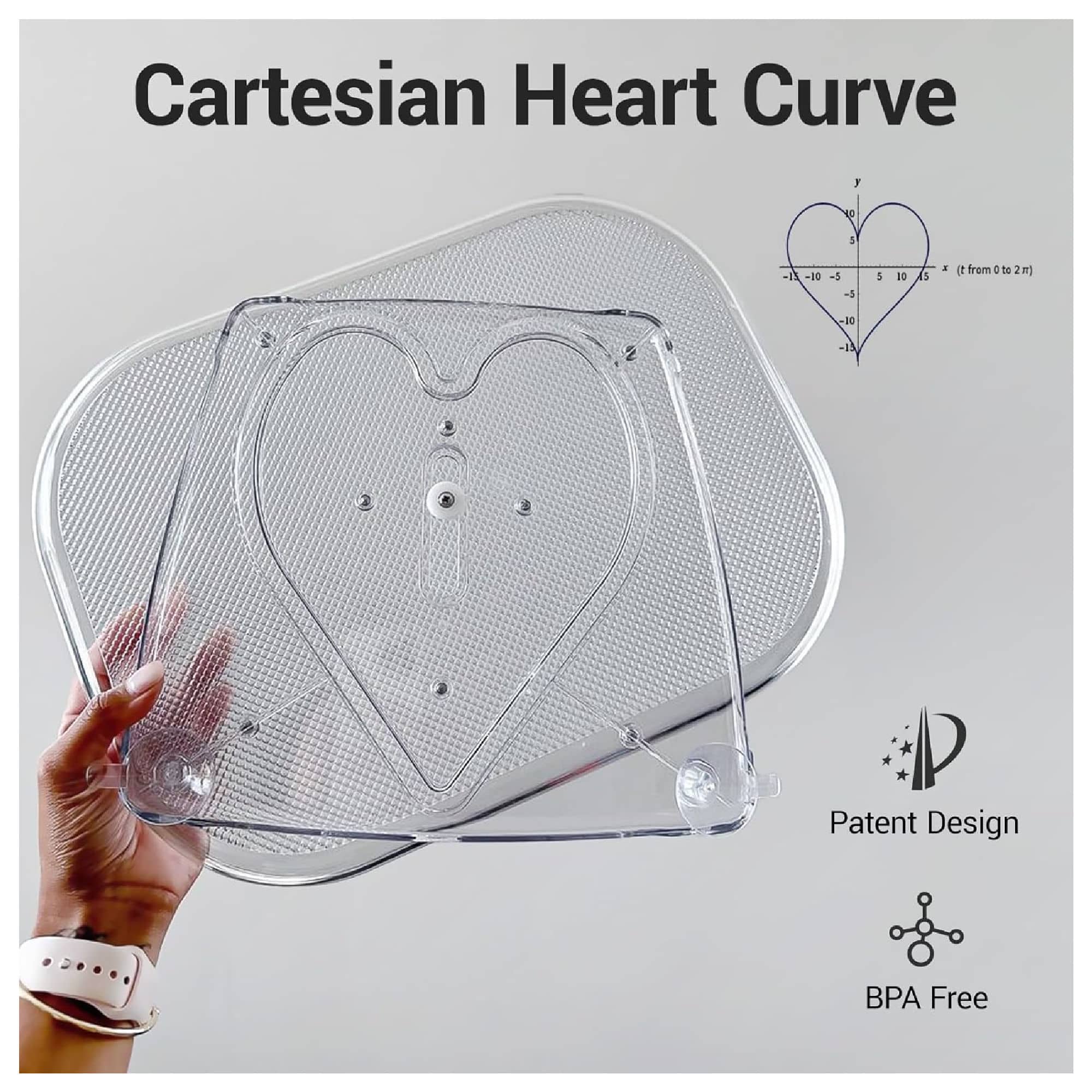 A person holds a transparent heart-shaped pan lid with a Cartesian heart curve design. Text reads "Patent Design" and "BPA Free." Graph of heart curve is shown.