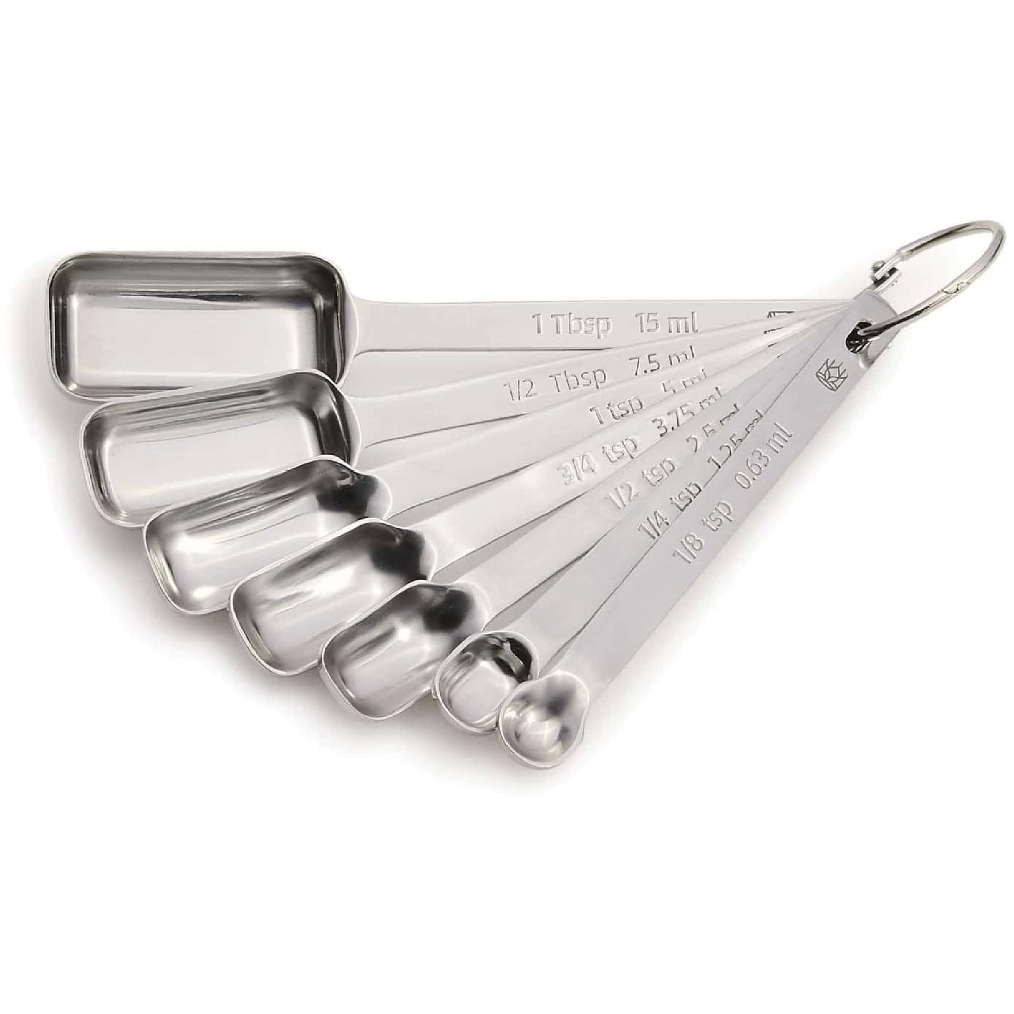 Set of six stainless steel measuring spoons on a ring, labeled with measurements from 1 tablespoon to ⅛ teaspoon.