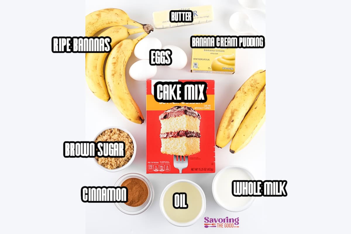 Top-down view of ingredients for banana cake using cake mix: ripe bananas, butter, eggs, banana cream pudding, brown sugar, cinnamon, oil, and whole milk.